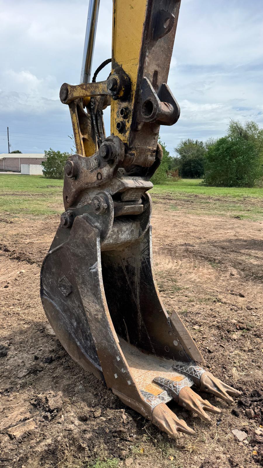 Excavator bucket and teeth on a dirt jobsite